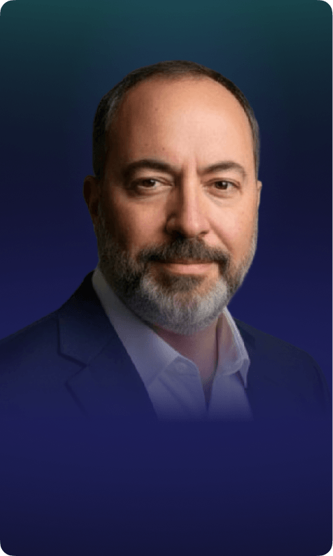 Alessandro Dutto in a suit with a beard, exuding confidence and professionalism.