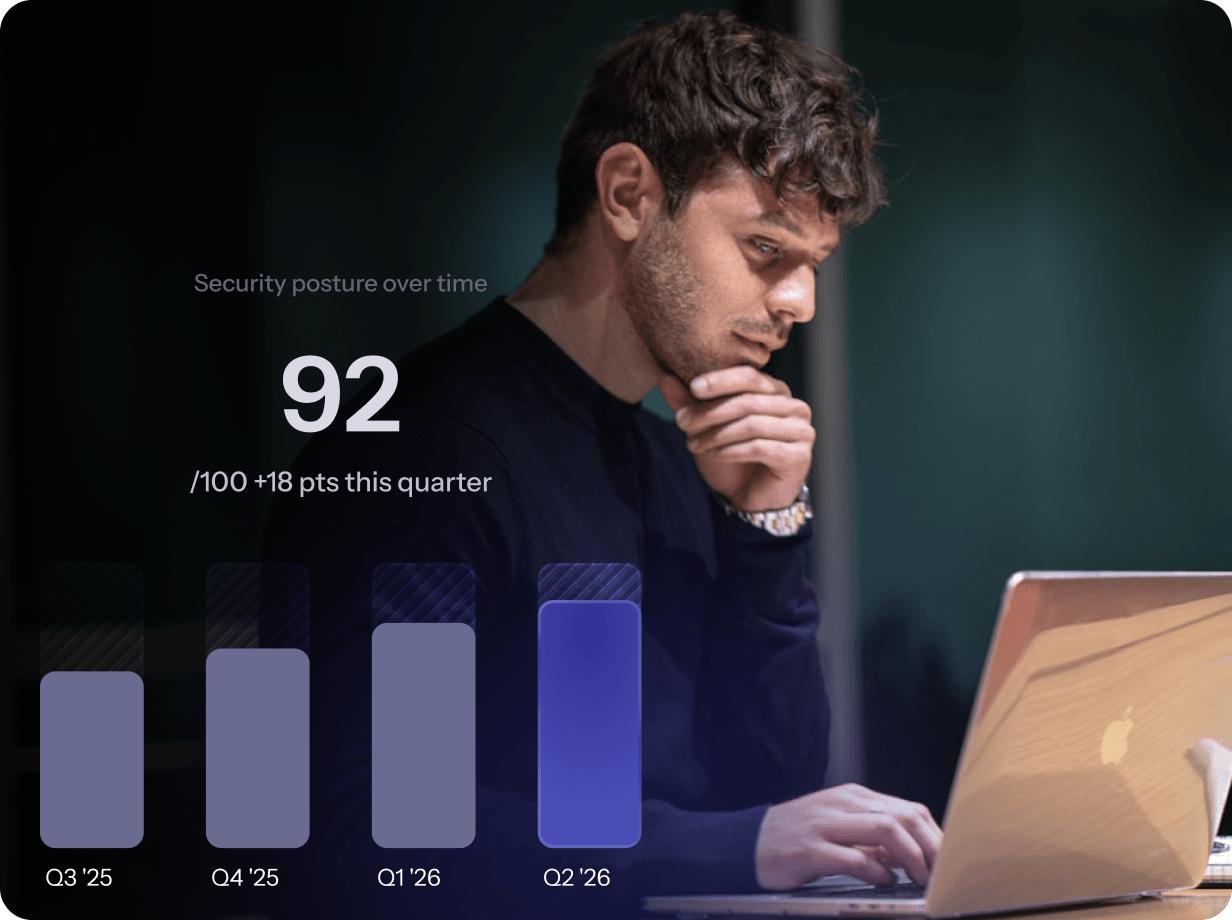 A man gazes at his laptop screen displaying a colorful bar graph, analyzing data trends.